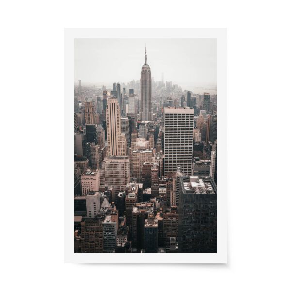 Fine art photograph of the New York City skyline with the Empire State Building centered on a hazy day, featuring warm, muted city tones.