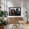 Framed Icelandic horse photography print with snow-dusted manes, styled in a warm, light-filled dining space with modern natural decor.