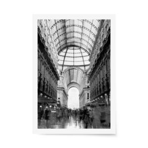 Monochrome long exposure photo of Milan’s historic Galleria, capturing motion blur of shoppers under the ornate arched glass ceiling.