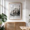 Paris cityscape double exposure print in minimalist wood frame, displayed in a sunlit modern interior with neutral decor.